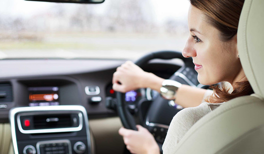 Mature Student smiling and Driving